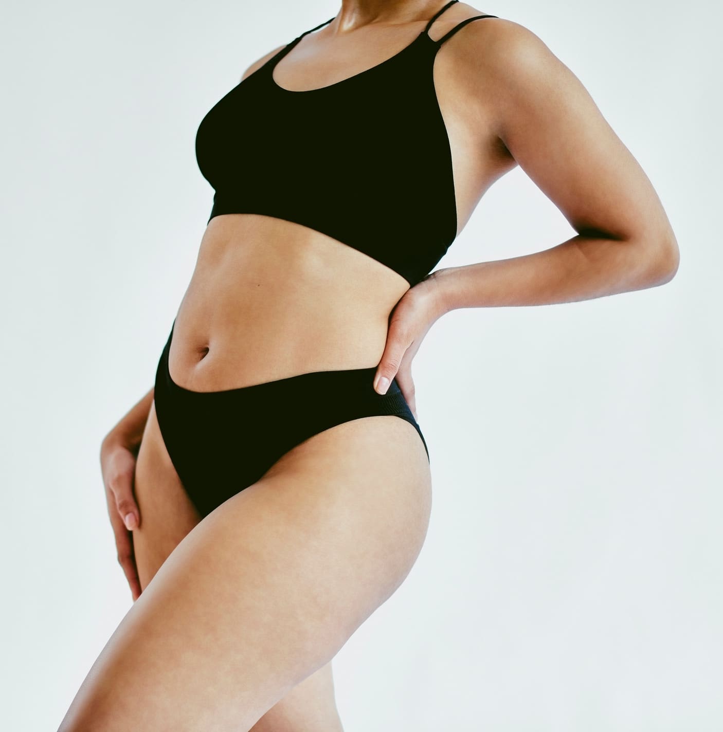 Natural body, underwear and woman in studio with gray background and copy space. Closeup of empowerment, young and beautiful girl with body positive and self love mindset embracing beauty of her skin Vaginal Rejuvenation in Jacksonville, FL