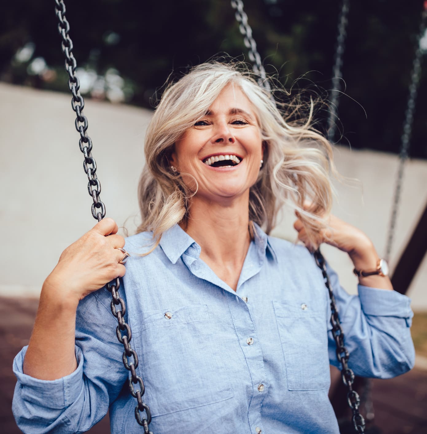 Portrait of mature woman with gray hair sitting on swing Restylane® in Jacksonville, FL